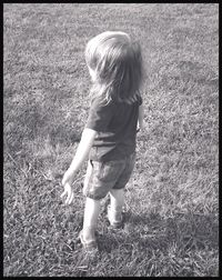 Girl standing on grass in park