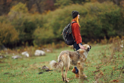 Man with dog on field