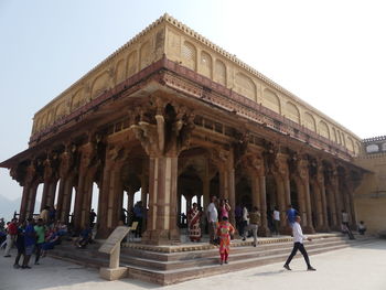 Group of people in front of historical building