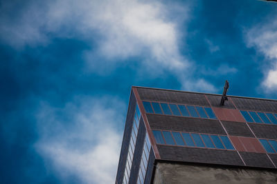 Low angle view of building against blue sky