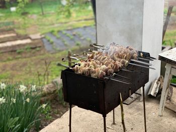 High angle view of meat on barbecue grill