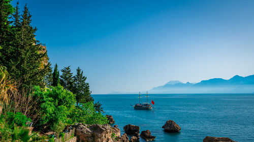 Scenic view of sea against clear blue sky