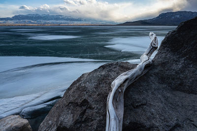 Scenic view of sea against sky during winter