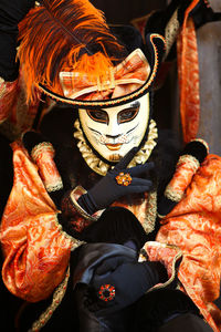 Midsection of person wearing mask