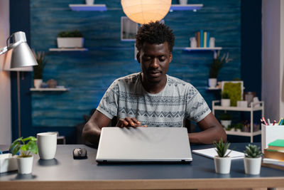 Young man using laptop on table