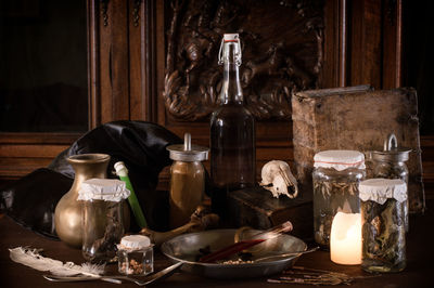 Close-up of wine glasses on table