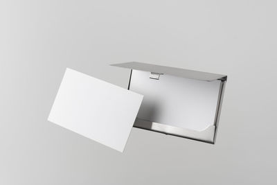 Low angle view of empty paper against white background