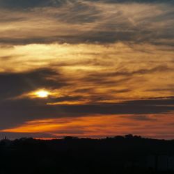 Scenic view of dramatic sky during sunset