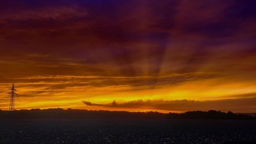 Scenic view of dramatic sky during sunset