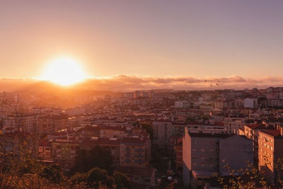 High angle view of townscape against sky during sunset