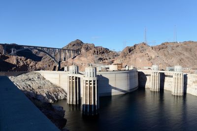 View of dam against clear blue sky