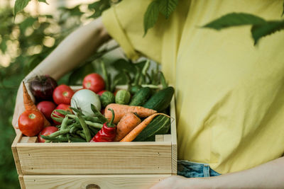 Midsection of woman holding food