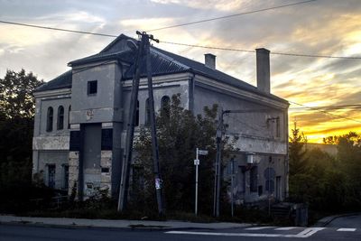 Built structure against sky at sunset
