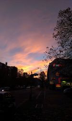 View of city street at sunset