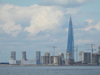 Modern buildings in city against sky