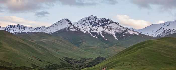 Scenic view of snowcapped mountains against sky