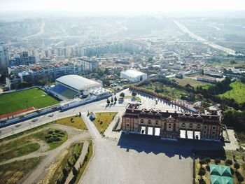 High angle view of crowd by buildings in city