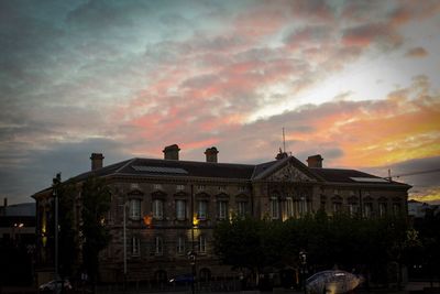 Building against sky at sunset