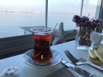 Glass of tea on table