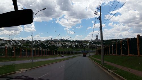 View of road against cloudy sky