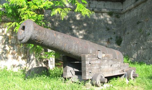 Old rusty wheel on field