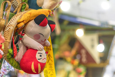 Close-up of stuffed toy hanging in store