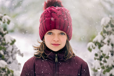 Portrait of woman in hat during winter