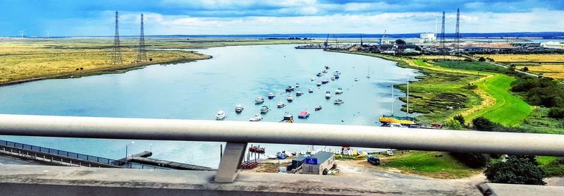High angle view of people by river against sky