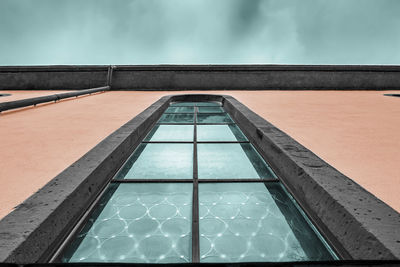 Low angle view of swimming pool against sky