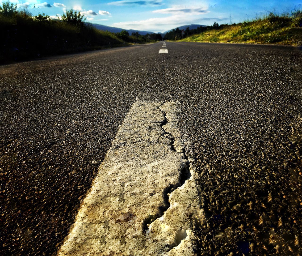 road, asphalt, day, transportation, the way forward, outdoors, textured, landscape, no people, tire track, nature, sky, close-up