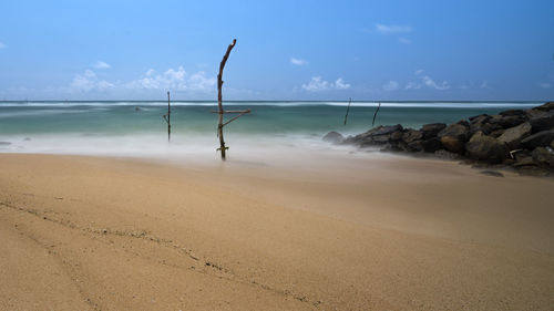 Scenic view of beach against sky