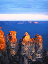 Rock formations on landscape against sky