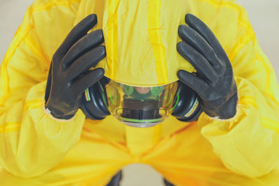 Depressed man wearing protective suit