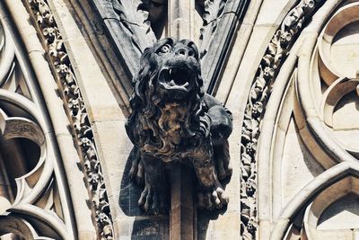 Low angle view of statue against building