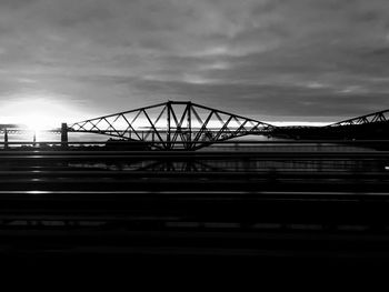 Low angle view of train on bridge against sky