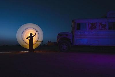 Light painting in the abandoned bus in the middle of desert in abu dhabi uae.