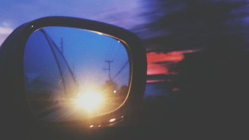 Reflection of sky in water at sunset