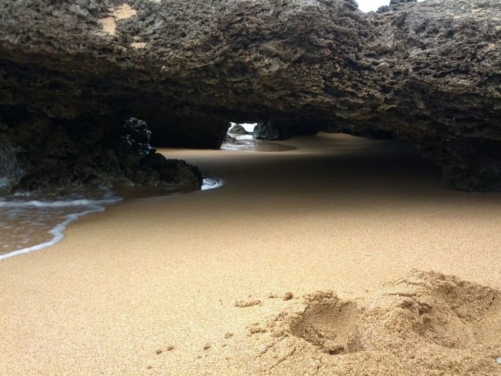 water, rock formation, beach, sea, sand, rock - object, beauty in nature, tranquility, tranquil scene, scenics, nature, shore, rock, cliff, surf, sunlight, mountain, geology, coastline, idyllic