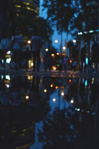 Reflection of buildings in city at night