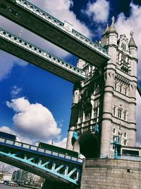 Low angle view of building against cloudy sky
