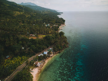 High angle view of trees by sea against sky