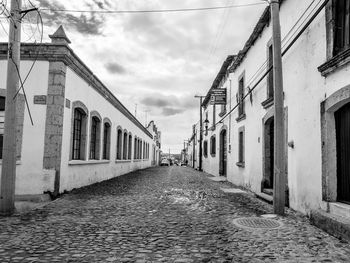 Narrow alley along buildings