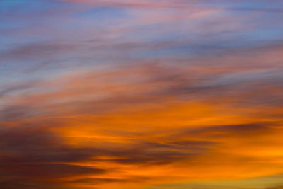 Low angle view of cloudy sky at sunset