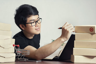 Portrait of boy holding eyeglasses