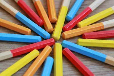 High angle view of pencils on wooden table