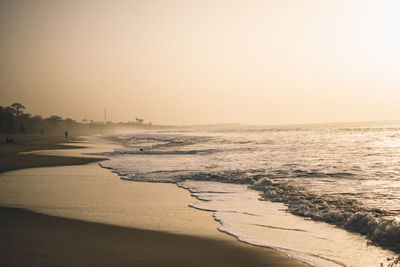 Scenic view of sea against clear sky during sunset