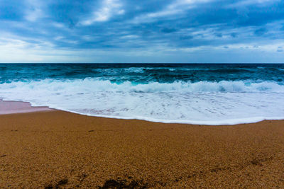 Scenic view of beach against sky
