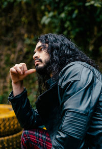 Young man looking away with jacket