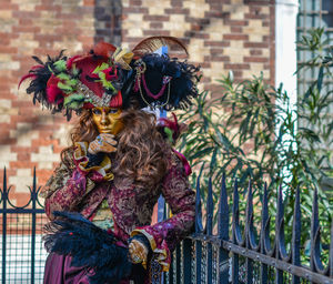 Portrait of woman dressed up for carnival at yard