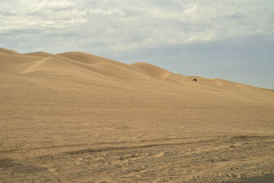 Atv off-road all terrain vehicles driving over the sand dunes for entertainment and recreation